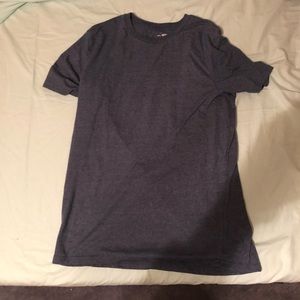 3 plain colored shirts. One is from J. Crew